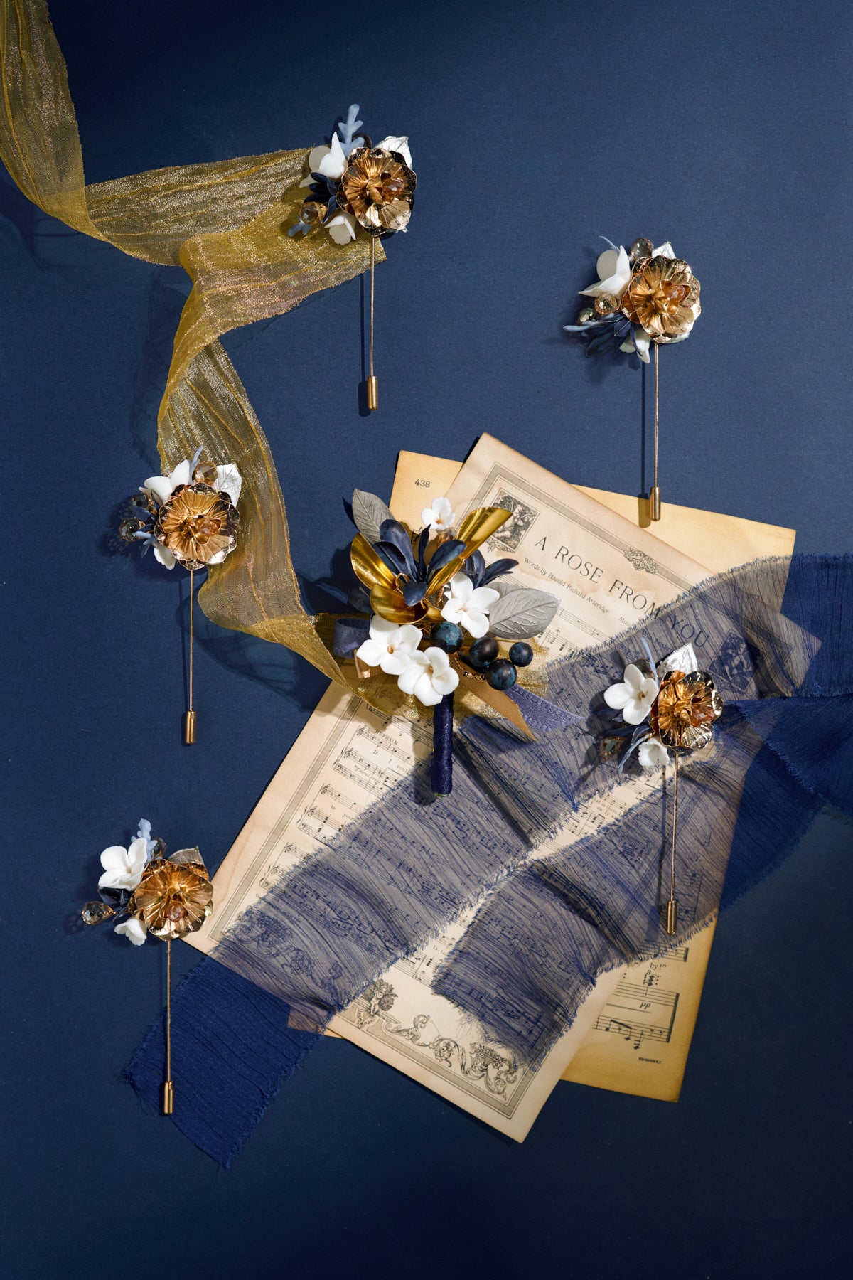 Boutonnieres in Stately Navy & Gold